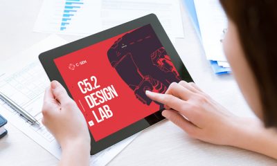 Free-Woman-Holding-Modern-Digital-Tablet-Mockup-PSD-2018