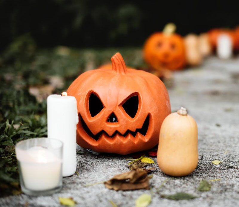 Halloween-Pumpkin-With-Candle-Near-Jack-o-Lantern