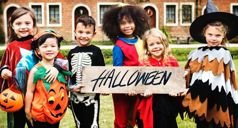 Kids-Wearing-Halloween-Costume-With-Banner