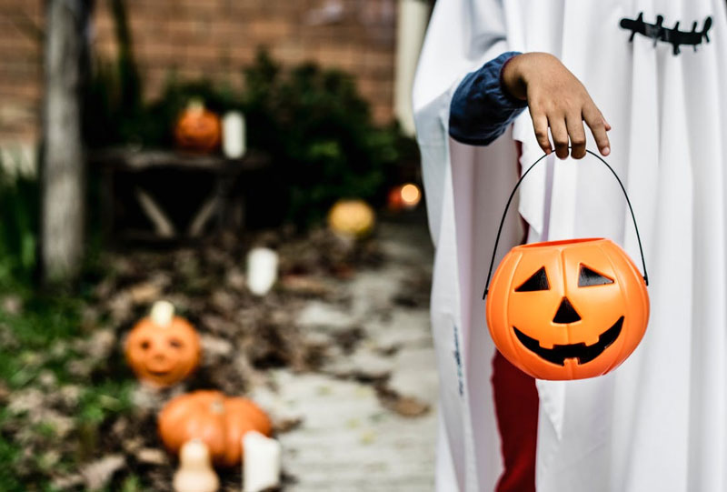 Man-Holding-Halloween-Pumpkin-Bucket